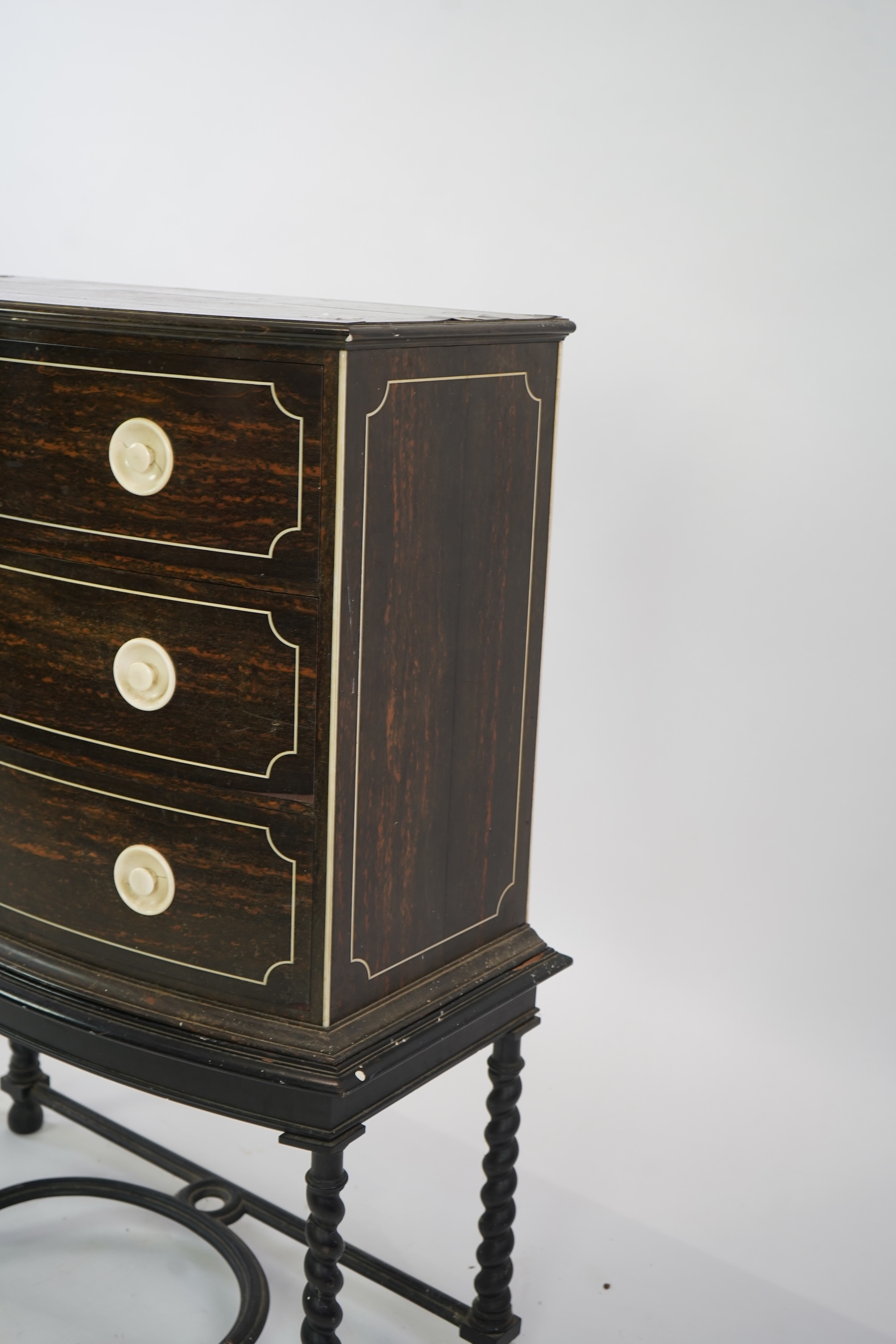 An early 20th century ivory mounted coromandel three drawer bowfront chest, stamped Callow of Mount Street, London